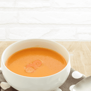 carrot ginger soup on brown napkin