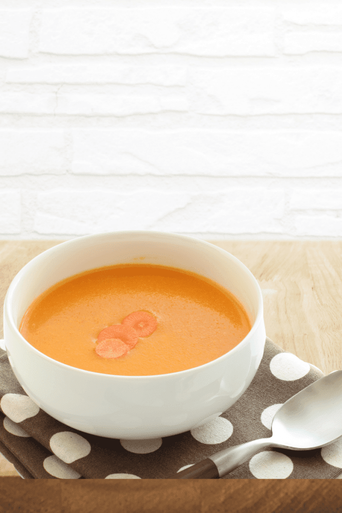 carrot ginger soup on brown napkin