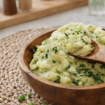 Creamy Instant Pot Irish colcannon (mashed potatoes with cabbage and kale) in a wooden bowl